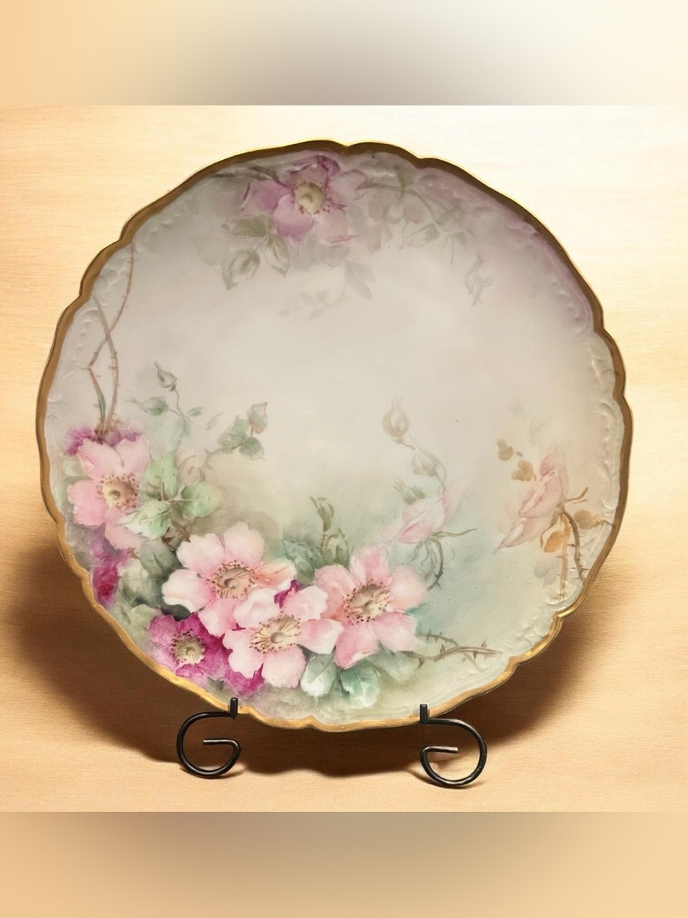 antique 1906 hand-painted Limoges porcelain plate featuring wild roses.
